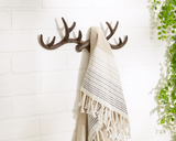 Add rustic charm to a cabin or lake house with this wrought iron wall hook. It features six spots for hanging towels or other items. This versatile wall hook would great in a mud room, garage, or bathroom.