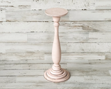 If you’re looking for shabby cottage chic dining table decorations or shelf decor, look no further! These hand-painted, wood candle holders complement almost any home or dining room decor. And they are a great choice for a farmhouse chic wedding reception. Place several of these candlesticks in a group for centerpiece or on a mantel in a living room for a vintage-inspired candlescape.
These candle holders are painted in light pink and accented with a hand-rubbed java brown antiquing glaze to bring out thei