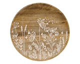 This shallow, decorative plate is made of dark wood with a natural-grain finish. The plate has a smooth, carved texture and features an embossed wildflower design inlaid with white paint. Display this plate using a plate holder or use as a base for assorted tabletop decor, fillers, or candles. This is also a great affordable gift choice.<br>