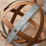 This set of three decorative sculptures mixes contemporary style with its classic shape and rustic warmth. These are great pieces for adding interest to a book shelf or coffee table. Group several of them together in a centerpiece bowl for a dramatic statement piece. The possibilities are endless!