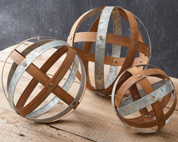 This set of three decorative sculptures mixes contemporary style with its classic shape and rustic warmth. These are great pieces for adding interest to a book shelf or coffee table. Group several of them together in a centerpiece bowl for a dramatic statement piece. The possibilities are endless!