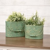 Dragonfly metal container set
These buckets are unique decorative accents crafted from metal with elegant, vintage-inspired style. Each bucket features an allover embossed dragonfly pattern and a rich green-copper finish. Wooden handle grips add a rustic touch to each bucket.
Materials:
Metal, wood
Dimensions:
Smaller bucket -
6" high x 4 1/4" deep x 8" wide
Larger bucket -
7 1/4" high x 5" deep x 9 3/4" wide
