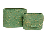 Dragonfly metal container set
These buckets are unique decorative accents crafted from metal with elegant, vintage-inspired style. Each bucket features an allover embossed dragonfly pattern and a rich green-copper finish. Wooden handle grips add a rustic touch to each bucket.
Materials:
Metal, wood
Dimensions:
Smaller bucket -
6" high x 4 1/4" deep x 8" wide
Larger bucket -
7 1/4" high x 5" deep x 9 3/4" wide