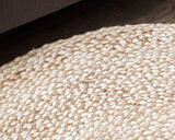 Hand-braided speckled hen round jute accent rug