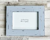 Complete your baby boy nursery with this lovely picture frame. It goes well with almost any style of home decor, including coastal farmhouse. This frame would also be a lovely choice for a baby shower gift.  Sold individually, each frame is painted in layers of dark grey and charcoal black before being distressed. It is then sealed with varnish. Each frame comes with a dowel rod for vertical and horizontal tabletop display.