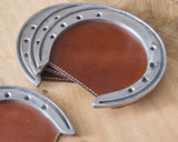Our unique coasters will bring the essence of the wild west to your tables. Protect your surfaces from sweating drinks in style. Coasters are created with leather and aluminum horseshoes.
