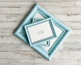 Add vintage style to an entryway or living room with a custom-made gallery picture frame set that complements almost any home decor, including coastal farmhouse and country cottage.
Every collection will include frames ranging in size from 5" x 7" photos to 11” x 14” pictures. All picture frame sets will include wood frames that have simple, classic designs, as shown above in the example photos. Your frames will come with glass, newly installed mounting hardware, acid-free backing, and hanging hardware al