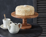 Feature homemade cupcakes, cheeses, and other delicious treats atop this lovely cake stand. Detailed with beautiful wood grain, this mango wood stand is handcrafted and features a turned wood base. Real wood is a product of nature, and as such, no two pieces are alike. Variations in grain, patterns, and color are to be expected and help create a beautiful and unique one-of-a-kind piece. This item is food safe.
Materials:
Mango wood
Dimensions:
6 1/4" high x 12" diameter
Care:
Hand-wash only