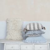 Pale blue ruffle pillow
This pale blue pillow with ruffled trim is a blend of comfort and charm. The soothing pale blue hue complements the playful ruffled edges, creating a pillow that's both visually appealing and cozy. It is the ideal size for adding a pop of color and a dash of elegance to any room. Whether it's enhancing a farmhouse bench or adding a touch of whimsy to an eclectic living room, this pillow is a delightful addition to any home. Made from soft cotton, this pillow is perfect for lounging
