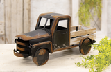 Capture the essence of vintage charm with this distressed black metal farm truck. Black painted metal with rusty distressing and a whitewashed wooden truck bed makes this timeless piece. It is perfect for a variety of settings, including shelves, mantels, and tabletops, adding a touch of vintage farmhouse style to any room. Fill it with seasonal faux florals or everyday greenery for a charming touch.
Materials:
Wood, metal
Dimensions:
8 3/4" high x 6" deep x 18" long