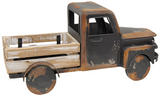 Capture the essence of vintage charm with this distressed black metal farm truck. Black painted metal with rusty distressing and a whitewashed wooden truck bed makes this timeless piece. It is perfect for a variety of settings, including shelves, mantels, and tabletops, adding a touch of vintage farmhouse style to any room. Fill it with seasonal faux florals or everyday greenery for a charming touch.
Materials:
Wood, metal
Dimensions:
8 3/4" high x 6" deep x 18" long