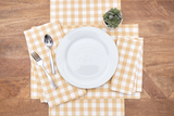 With a classic cornsilk yellow and white gingham check, this placemat was made for summer picnics and country farmhouse style. This woven placemat is crafted of cotton and instantly brings sunshine to any kitchen.
Materials:
100% Cotton
Dimensions:
13" high x 19" wide
Care:
Machine washable