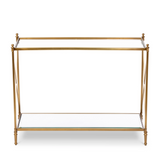 Antique brass glass console table
Add traditional style to an entryway with this gorgeous console table. It features a metal frame in an antique gold-toned brass finish and glass shelving. This table would work perfectly with chinoiserie vase filled with fresh flowers and a candlescape. 
Materials:
Glass, metal
Dimensions:
30" high x 13 1/2" deep x 39" long