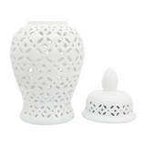 Elevate your decor with this stunning white ceramic jar featuring intricate cutout patterns. Its timeless design adds sophistication to any home or living room, making it a perfect accent piece for classic interiors. Its sturdy stoneware build is resistant to chipping and fading, offering a lasting statement piece for your bedroom, office, or entryway. Ideal for tabletops or console tables, this elegant white jar blends seamlessly with various decor styles. Whether placed alone or paired with other pieces,