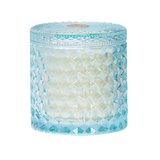 'Azure Sands' candle 
Bask in the essence of a sun-drenched escape. Azure Sands opens with a burst of sugared citrus and juicy tropical fruits, layered over blooming blue jasmine. It's an energizing yet calming scent ”like walking barefoot along the coast with warm breeze and salt in the air." It comes in a shimmery glass jar with matching lid. The container is beautiful and can easily be repurposed when the time comes. This candle, which is vegan and cruelty free, is a great option for an affordable