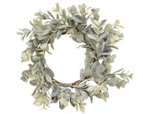 Muted boxwood candle ring
This boxwood candle ring will add natural notes to your space. This full, boxwood style candle ring has a lovely ombre green color scheme with a light white dusting an understated feel. Perfect for candles or used as a small wreath, this ring will complement a wide variety of colors and decor. The subtle coloring and style of this ring makes it possible to use it year round.
Materials:
Plastic, foam
Dimensions:
3 1/2" inside diameter 
7" diameter overall
