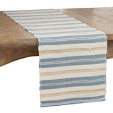 Striped blue & tan table runner  The striped design table runner is a highly versatile piece for your tabletop, as you can easily dress it up or down to fit both everyday meals and casual occasions. The different stripes create the perfect backdrop for a stylish meal. You can pair it with either matching placemats or solid colors for a contrasting effect.   Materials: Water hyacinth  Dimensions: 14" wide x 72" long  Care: Spot-clean only