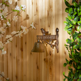 Cast iron bird-themed garden sign with bell