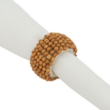 This wooden beaded napkin ring is a great way to elevate the look of your tabletop without overshadowing it. Casual, yet stylish these napkin rings bring texture to your place settings, as well as dimension. They're very easy to pair with a wide range of table linens and dinnerware.  These napkin rings are sold individually or in sets of four.  Materials: Wood, fabric   Dimensions: 1 1/2" in diameter