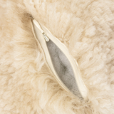 This sheepskin orb pillow is a beautiful and comfortable accessory for the home. It has a sheepskin cover that is warm and luxurious. The cover features a cream color that is neutral and elegant, and a round shape that is unique and fun. The pillow has a polyester insert fill that is soft and durable. Use this pillow as a backrest, a headrest, or a decorative accent. Place it on the sofa, bed, chair, or bench, and mix and match it with other pillows to create a cozy and stylish look.