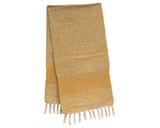 This decorative table runner featuring a rustic woven texture made of warm yellow and cream fabric is perfect for your rustic cabin. The runner pattern includes two sections of diamond-patterned stitching, and either end of the runner is decorated with simple cream fringe detailing. This runner can be displayed year-round, and is especially perfect for summer and fall with its warm, cozy feel.