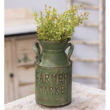 This rustic milk can features a distressed olive green finish. The can is embossed with the words, "Farmers Market. Fresh & Healthy," and features two curved handles. This can is the perfect size for silk arrangements or dried grasses.<br>