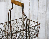 Double-tiered basket stand
Whether used to hold wrapped food or to display fresh fruit, this wired two-tier basket stand adds just the right amount of primitive style to your country kitchen. It features a rustic, distressed finished and a medium-toned brown wooden handle along the top.
Materials:
Metal, wood
Dimensions:
10” wide x 7” deep x 16” tall