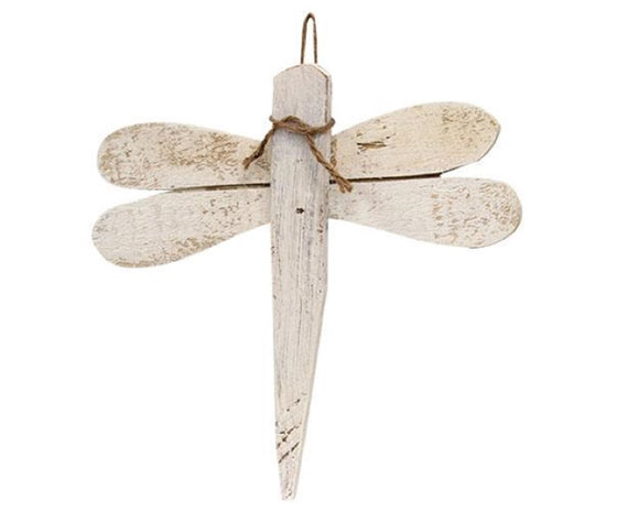 Add whimsical charm to your lake house with this decorative hanging cutout. Made in the USA of chunky natural wood, this dragonfly has a distressed white painted finish, as well as a jute tie at the top. This piece is wonderful for spring and summer, and it can be displayed hanging on a wall or door using the jute hanger attached at the back.<br>