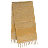Mustard yellow long table runner with fringe detail along the ends