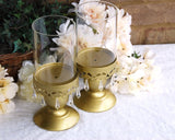 gold beaded pillar candle holders with glass hurricanes