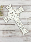 Ornate worn white iron wall hanging cross