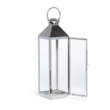 Tall silver lantern with clear glass panels on a white background