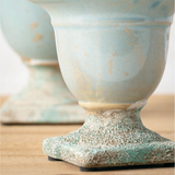 Terracotta, clay, and even concrete have unique properties of being sustainable, safe, durable and versatile enough for every style! No matter your personal style, there is one key factor to nailing this trend for your home design: Find the beauty in the not-so-perfect. These pots do just that. Each pot features a distressed aqua blue finish for a vintage-inspired look. They do not come with drain holes. These would look great on a coffee table or entryway table.&nbsp;