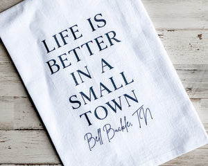 White 'Bell Buckle' kitchen towel
*Made to order*

Our cotton tea towels are heavy-weight, highly absorbent, and lint-free. This design features the phrase the "Life is better in a small town" and the town "Bell Buckle" printed with water-based ink atop a white background. These are perfect for year-round use and make for a great gift.

This item is proudly made in the USA.&nbsp;

Materials:
Cotton

Dimensions:
27" wide x 27" long

Care:
Machine-washable, tumble try&nbsp;