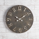 Large black wall hanging clock   Add rustic charm to a living room with this vintage-inspired clock. It features as a distressed black and white design with coordinating hands. At almost 2 feet in diameter, this clock is just the right size for an entryway.  Materials: Wood, metal  Dimensions: 23 1/2" in diameter overall