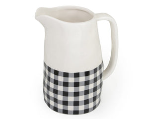 Serve up your favorite drink with this adorable pitcher. It features a black and white buffalo check design with a white handle. This pitcher is also a great choice for an affordable, yet nice, gift.  Materials: Dolomite ceramic  Dimensions: 4 13/16" diameter x 7 1/2" high