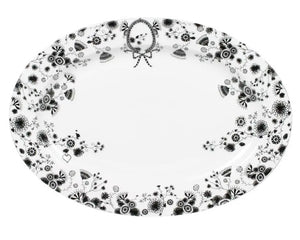 Black &amp; white porcelain floral serving platter

A study in detail, this sophisticated white and black serving platter mixes modern femininity, high fashion, and enchanting illustrative floral designs with a hint of naiveté. Created by Dutch fashion designer and artist Merel Boers, Miss Blackbirdy’s designs and illustrations are inspired by the world around her. She invites us all to “take a walk through the world of Miss Blackbirdy” and experience this lovely concept of high fashion and modern femininit