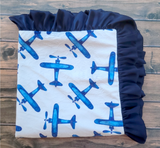 blue airplanes on white background baby blanket with navy blue satin ruffle trim