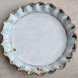 Multi-colored handmade stoneware pie plate

Bake your favorite dessert in this shallow pie plate. It is pretty enough to also double as a serving piece. This pie plate is handmade and hand-painted in Mississippi by artist Kim Ries. This item makes for a great wedding gift.&nbsp;

This item is proudly made in the USA.

Materials:
Stoneware

Dimensions:
10 1/2" diameter x 1 1/2" high

Care:
Oven and dishwasher safe