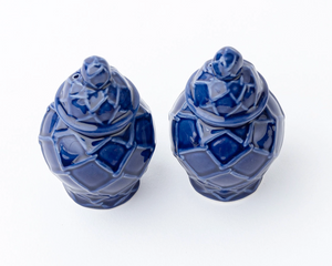 Two blue ceramic vases with geometric patterns on a white background
