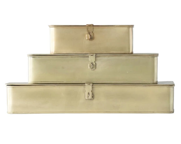 Bring a sense of style to your home with this set of three metal boxes with a gold finish. Perfect for any room, these boxes can be stacked or placed in separate spaces. These versatile boxes will hold an array of odds and ends. Designed with a hinged lid and a latch with the ability to be locked (lock not included) these boxes can hold your valuable small keepsakes.