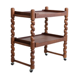 Wooden bar cart with two shelves on wheels against a white background