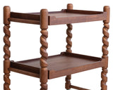 Wooden side table with twisted legs on a white background