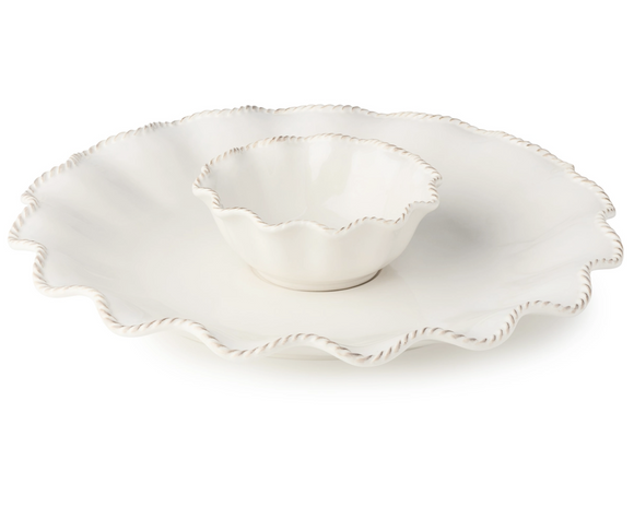 This chip and dip platter is crafted to elevate both everyday meals and special occasions. Its creamy white glaze and soft embossed detailing reflect timeless elegance, blending vintage charm with modern utility. Perfect for settings that celebrate tradition, each piece is designed to be both beautiful and functional — whether you're hosting a holiday gathering or serving a weekday dinner. Made from durable stoneware, it offers long-lasting performance with a look that never goes out of style.