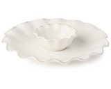 This chip and dip platter is crafted to elevate both everyday meals and special occasions. Its creamy white glaze and soft embossed detailing reflect timeless elegance, blending vintage charm with modern utility. Perfect for settings that celebrate tradition, each piece is designed to be both beautiful and functional — whether you're hosting a holiday gathering or serving a weekday dinner. Made from durable stoneware, it offers long-lasting performance with a look that never goes out of style.