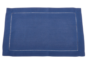 Blue placemat with white stitching on a white background