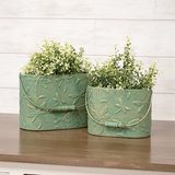 Dragonfly metal container set

These buckets are unique decorative accents crafted from metal with elegant, vintage-inspired style. Each bucket features an allover embossed dragonfly pattern and a rich green-copper finish. Wooden handle grips add a rustic touch to each bucket.

Materials:
Metal, wood

Dimensions:
Smaller bucket -
6" high x 4 1/4" deep x 8" wide

Larger bucket -
7 1/4" high x 5" deep x 9 3/4" wide