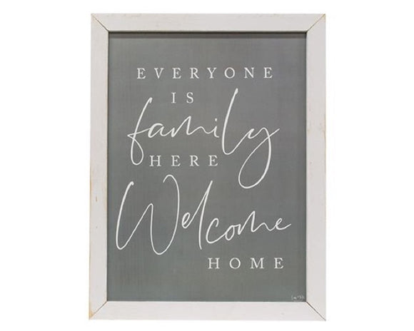 This sign features a distressed white frame with a gray background. It reads, 