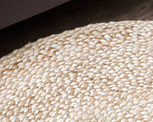 Hand-braided speckled hen round jute accent rug