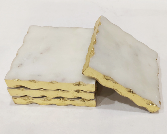 White marble coasters with gold foil edges